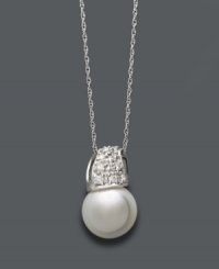 Give the gift of timeless beauty. This classic pendant by Belle de Mer defines elegance with a cultured freshwater pearl (9-10 mm) and sparkling, round-cut diamonds (1/6 ct. t.w.) in a 14k white gold wave setting. Approximate length: 18 inches. Approximate drop: 1/2 inch. Give the gift of timeless beauty. This classic pendant by Belle de Mer defines elegance with a cultured freshwater pearl (9-10 mm) and sparkling, round-cut diamonds (1/6 ct. t.w.) in a 14k white gold wave setting. Approximate length: 18 inches. Approximate drop: 1/2 inch.