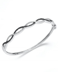 Standout sparkle. Victoria Townsend's sweetly contrasting bangle bracelet combines both round-cut black diamonds (1/5 ct. t.w.) and white diamond accents. Set in sterling silver. Approximate length: 7-1/4 inches. Standout sparkle. Victoria Townsend's sweetly contrasting bangle bracelet combines both round-cut black diamonds (1/5 ct. t.w.) and white diamond accents. Set in sterling silver. Approximate length: 7-1/4 inches.