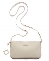 Upgrade any ensemble with this elegant design from DKNY. A convenient crossbody strap keeps the look modern, while soft, Saffiano leather and gleaming hardware lend a decidedly refined feel. Upgrade any ensemble with this elegant design from DKNY. A convenient crossbody strap keeps the look modern, while soft, Saffiano leather and gleaming hardware lend a decidedly refined feel.