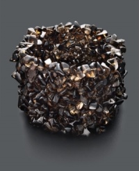 Channel your inner bohemian goddess with this chic stretch cuff. Features dozens of smoky quartz chips (300-350 ct. t.w.) for an earthy and organic look. Approximate length: 7-1/2 inches. Channel your inner bohemian goddess with this chic stretch cuff. Features dozens of smoky quartz chips (300-350 ct. t.w.) for an earthy and organic look. Approximate length: 7-1/2 inches.