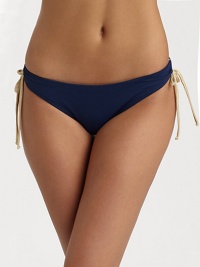 Sleek stretch nylon knit with soft ruching and contrast side ties.Elastic waistband Side ruching with contrast ties Fully lined 80% nylon/20% spandex Fully lined Hand wash Made in USAPlease note: Bikini top sold separately. Sleek stretch nylon knit with soft ruching and contrast side ties.Elastic waistband Side ruching with contrast ties Fully lined 80% nylon/20% spandex Fully lined Hand wash Made in USAPlease note: Bikini top sold separately.