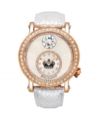 Golden touches of rose and sparkles galore. Queen Couture watch by Juicy Couture crafted of white snake-embossed leather strap and round rose-gold-plated stainless steel case. Bezel crystallized with Swarovski elements. Textured silver tone dial features ring of crystals at outer edge, large crystal at twelve o'clock and a crystal-accented subdial at six o'clock with crown logo at center and two rose-gold tone hands. Quartz movement. Water resistant to 30 meters. Two-year limited warranty. Golden touches of rose and sparkles galore. Queen Couture watch by Juicy Couture crafted of white snake-embossed leather strap and round rose-gold-plated stainless steel case. Bezel crystallized with Swarovski elements. Textured silver tone dial features ring of crystals at outer edge, large crystal at twelve o'clock and a crystal-accented subdial at six o'clock with crown logo at center and two rose-gold tone hands. Quartz movement. Water resistant to 30 meters. Two-year limited warranty.