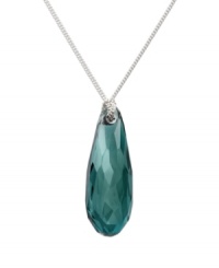 Create a splash with a single drop. This modern and feminine necklace presents a faceted Indicolite Satin crystal in an exclusive cut. Pendant hangs elegantly from a silver tone mixed metal chain. Approximate length: 19-3/4 inches. Approximate drop: 1 inch. Create a splash with a single drop. This modern and feminine necklace presents a faceted Indicolite Satin crystal in an exclusive cut. Pendant hangs elegantly from a silver tone mixed metal chain. Approximate length: 19-3/4 inches. Approximate drop: 1 inch.