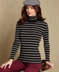 Kick up your wardrobe with Tommy Hilfiger's autumn-ready turtleneck. The ribbed knit design and embroidered flag logo elevate it into a must-have basic. Kick up your wardrobe with Tommy Hilfiger's autumn-ready turtleneck. The ribbed knit design and embroidered flag logo elevate it into a must-have basic.