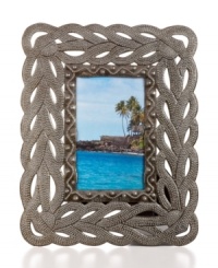 Water works. Handcrafted with a fluid design and texture reminiscent of fish, this charming picture frame recalls the lush and beautiful Caribbean coast that inspires so many Haitian artists. Water works. Handcrafted with a fluid design and texture reminiscent of fish, this charming picture frame recalls the lush and beautiful Caribbean coast that inspires so many Haitian artists.