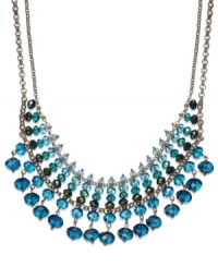 A pretty palette of blue ombre glass beads (4-10 mm) decorate this chic frontal necklace from c.A.K.e. by Ali Khan. Crafted in gold tone mixed metal. Approximate length: 14 inches + 3-inch extender. Approximate drop: 1-3/4 inches.