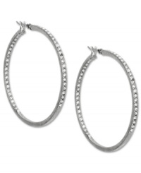 Pave your way to pure fashion. These Jones New York hoop earrings sparkle with crystal glass accents. Crafted in worn silver tone mixed metal. Approximate diameter: 1-3/4 inches. Pave your way to pure fashion. These Jones New York hoop earrings sparkle with crystal glass accents. Crafted in worn silver tone mixed metal. Approximate diameter: 1-3/4 inches.