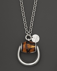 An equestrian-inspired bamboo and sterling silver pendant necklace from Gucci. An equestrian-inspired bamboo and sterling silver pendant necklace from Gucci.