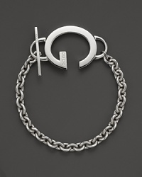 This sterling silver toggle bracelet bears Gucci's signature G. This sterling silver toggle bracelet bears Gucci's signature G.