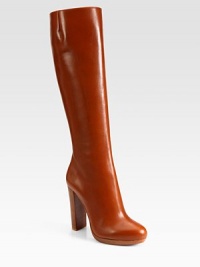 Richly hued leather in a knee-high silhouette with a side zipper, sky-high heel and signature red leather sole. Stacked heel, 4 (100mm)Covered platform, ½ (15mm)Compares to a 3½ heel (90mm)Shaft, 15½Leg circumference, 14Leather upperSide zipperLeather liningSignature red leather solePadded insoleMade in ItalyOUR FIT MODEL RECOMMENDS ordering one size up as this style runs small. Richly hued leather in a knee-high silhouette with a side zipper, sky-high heel and signature red leather sole. Stacked heel, 4 (100mm)Covered platform, ½ (15mm)Compares to a 3½ heel (90mm)Shaft, 15½Leg circumference, 14Leather upperSide zipperLeather liningSignature red leather solePadded insoleMade in ItalyOUR FIT MODEL RECOMMENDS ordering one size up as this style runs small.