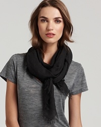 A large dyed woven scarf in a lightweight fabric with self fringe edges. A large dyed woven scarf in a lightweight fabric with self fringe edges.