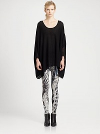 Poncho-inspired tailoring revives this lengthy cotton and cashmere sweater. RoundneckDropped shouldersLong poncho sleevesContour hem70% cotton/30% cashmereDry cleanImportedModel shown is 5'11 (178cm) wearing US size Small. Poncho-inspired tailoring revives this lengthy cotton and cashmere sweater. RoundneckDropped shouldersLong poncho sleevesContour hem70% cotton/30% cashmereDry cleanImportedModel shown is 5'11 (178cm) wearing US size Small.