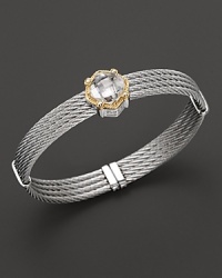 Glittering white topaz and chic stainless steel elegantly contrast with bright, bold 18K yellow gold. Glittering white topaz and chic stainless steel elegantly contrast with bright, bold 18K yellow gold.