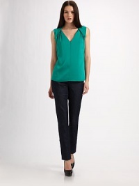 All about shape, in stretch silk georgette with soft pleating and halter-look detailing at the shoulders.Deep V necklineSleevelessHalter-look angled bands ease into back foldover collarSide zip closureAbout 24 from shoulder to hem95% silk/5% elastaneDry cleanImported Model shown is 5'9½ (176cm) wearing US size Small. All about shape, in stretch silk georgette with soft pleating and halter-look detailing at the shoulders.Deep V necklineSleevelessHalter-look angled bands ease into back foldover collarSide zip closureAbout 24 from shoulder to hem95% silk/5% elastaneDry cleanImported Model shown is 5'9½ (176cm) wearing US size Small.