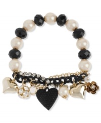 Charm your heart. Betsey Johnson's bracelet highlights black faceted beads and glass pearls on a half-stretch chain. Features a crystal cup chain accent, black heart with black-colored crystal accents, gold tone bubble hearts, crystal fireball bead and gold tone flower charm. Set in gold tone mixed metal. Approximate length: 7-1/2 inches. Charm your heart. Betsey Johnson's bracelet highlights black faceted beads and glass pearls on a half-stretch chain. Features a crystal cup chain accent, black heart with black-colored crystal accents, gold tone bubble hearts, crystal fireball bead and gold tone flower charm. Set in gold tone mixed metal. Approximate length: 7-1/2 inches.