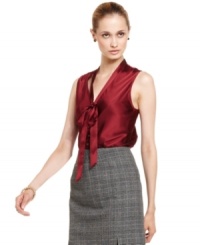 Crimson charmeuse fabric and a bow neckline take Nine West's top from a basic blouse to a fashionable standout. Crimson charmeuse fabric and a bow neckline take Nine West's top from a basic blouse to a fashionable standout.