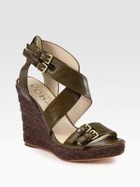 Wide, adjustable leather straps, elevated by a braided leather wedge and platform. Braided leather wedge, 4 (100mm)Braided leather platform, 1 (25mm)Compares to a 3 heel (75mm)Leather upperLeather lining and solePadded insoleImported Wide, adjustable leather straps, elevated by a braided leather wedge and platform. Braided leather wedge, 4 (100mm)Braided leather platform, 1 (25mm)Compares to a 3 heel (75mm)Leather upperLeather lining and solePadded insoleImported