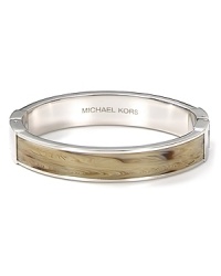 Add exotic edge to your accessory collection with MICHAEL Michael Kors' horn bangle. Whether you're downtown or on safari, this earth-toned bracelet loves bright separates and a wild itinerary. Add exotic edge to your accessory collection with MICHAEL Michael Kors' horn bangle. Whether you're downtown or on safari, this earth-toned bracelet loves bright separates and a wild itinerary.