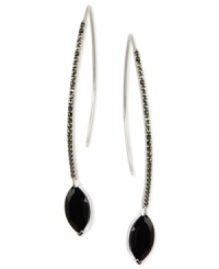 Display a bold touch with Judith Jack's drop earrings. The pair is crafted from sterling silver with marquise-shaped onyx (5-1/4 ct. t.w.) and marcasite (1/2 ct. t.w.) adding tones that are dark and dynamic. Approximate drop: 2-6/10 inches. Approximate diameter: 1 inch. Display a bold touch with Judith Jack's drop earrings. The pair is crafted from sterling silver with marquise-shaped onyx (5-1/4 ct. t.w.) and marcasite (1/2 ct. t.w.) adding tones that are dark and dynamic. Approximate drop: 2-6/10 inches. Approximate diameter: 1 inch.