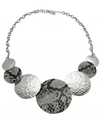 Striking python and textured circles create a unique design on this GUESS pendant necklace. Set in imitation rhodium-plated mixed metal. Approximate length: 16 inches + 2-inch extender. Approximate drop: 1-3/4 inches. Striking python and textured circles create a unique design on this GUESS pendant necklace. Set in imitation rhodium-plated mixed metal. Approximate length: 16 inches + 2-inch extender. Approximate drop: 1-3/4 inches.