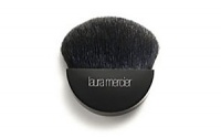 Laura Mercier Mineral Primer Brush is a black goat hair brush with half moon-shaped head and small handle for perfect application of Mineral Primer to quickly manuever the planes and contours of the face. 2.5 inches in length.