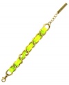 A bright idea. BCBGeneration gives its chain link bracelet, crafted from gold-tone mixed metal, a luminous touch with the addition of an intertwined neon yellow cord. Approximate length: 8 inches.