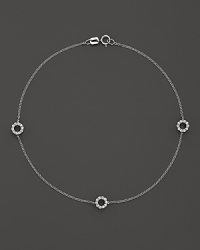 Diamonds sparkle from the circle stations on this dainty 14K white gold ankle bracelet.