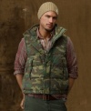 A rugged camo print lends a warm down vest military edge for casual, wear-anywhere style.