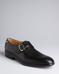 Affirm your taste for luxury with a pair of smooth leather loafers from Bally, featuring a monkstrap design to match your classic aesthetic. Affirm your taste for luxury with a pair of smooth leather loafers from Bally, featuring a monkstrap design to match your classic aesthetic.