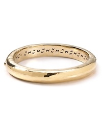 An essential bangle from Nadri is styled in hammered gold plate, which makes it the perfect piece for stacking and statement making. An essential bangle from Nadri is styled in hammered gold plate, which makes it the perfect piece for stacking and statement making.