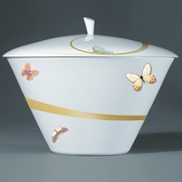 For over two centuries Raynaud has created unique Limoges porcelain, with a marked preference for relief shapes and generously colored and gilt decorations. Metamorphoses is a striking pattern of red and gold with a butterfly motif. For over two centuries Raynaud has created unique Limoges porcelain, with a marked preference for relief shapes and generously colored and gilt decorations. Metamorphoses is a striking pattern of red and gold with a butterfly motif.