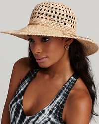 A natural raffia wide brim hat with an open crochet top gives a textural edge to your favorite ensemble. A natural raffia wide brim hat with an open crochet top gives a textural edge to your favorite ensemble.