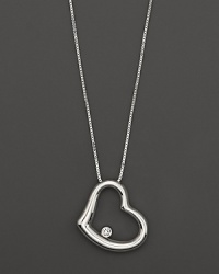 From the Tiny Treasures collection, a diamond accented heart necklace with signature ruby accent. Designed by Roberto Coin. From the Tiny Treasures collection, a diamond accented heart necklace with signature ruby accent. Designed by Roberto Coin.
