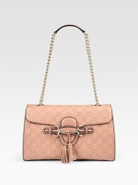 Guccissima leather flap design with GG logo print, light goldtone hardware and leather tassels. Chain and leather shoulder strap, 12 dropFlap-top closureThree inside open pocketsNatural cotton linen lining12½W X 7¼H X 2¼DMade in Italy Guccissima leather flap design with GG logo print, light goldtone hardware and leather tassels. Chain and leather shoulder strap, 12 dropFlap-top closureThree inside open pocketsNatural cotton linen lining12½W X 7¼H X 2¼DMade in Italy