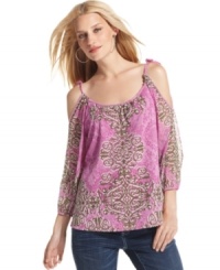 Fluid and exotically romantic, INC's printed blouse makes an alluring impression with sexy shoulder cutouts and delicate beading. Adjustable ties on top let you customize the look. Fluid and exotically romantic, INC's printed blouse makes an alluring impression with sexy shoulder cutouts and delicate beading. Adjustable ties on top let you customize the look.
