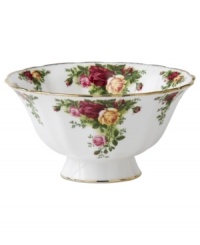 Garnished with the popular Old Country Roses dinnerware pattern, this footed Royal Albert bowl brings the bounty of the English countryside to your table in fine bone china with gold, scalloped edges. Garnished with the popular Old Country Roses dinnerware pattern, this footed Royal Albert bowl brings the bounty of the English countryside to your table in fine bone china with gold, scalloped edges.