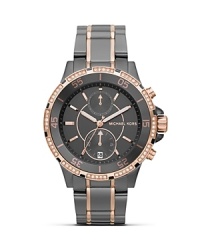 Surrender to sparkle with this Swarovski crystal-rimmed watch from MICHAEL Michael Kors, boasting an oversized case, sleek stainless steel bracelet and chronograph movement. Surrender to sparkle with this Swarovski crystal-rimmed watch from MICHAEL Michael Kors, boasting an oversized case, sleek stainless steel bracelet and chronograph movement.