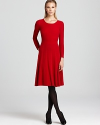A plush Armani Collezioni cashmere dress slips on for cozy chic. Complete with a subtly pleated skirt that flares elegantly from waistline to knee, this sweater style is winter's must have. A plush Armani Collezioni cashmere dress slips on for cozy chic. Complete with a subtly pleated skirt that flares elegantly from waistline to knee, this sweater style is winter's must have.