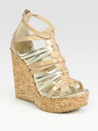 Glimmering metallic leather straps weave their way through glossy patent leather, concluding with a natural cork wedge and back zipper. Cork wedge, 5 (125mm)Cork platform, 1½ (40mm)Compares to a 3½ heel (90mm)Metallic leather and patent leather upperBack zipperLeather liningRubber solePadded insoleImportedOUR FIT MODEL RECOMMENDS ordering one size up as this style runs small. Glimmering metallic leather straps weave their way through glossy patent leather, concluding with a natural cork wedge and back zipper. Cork wedge, 5 (125mm)Cork platform, 1½ (40mm)Compares to a 3½ heel (90mm)Metallic leather and patent leather upperBack zipperLeather liningRubber solePadded insoleImportedOUR FIT MODEL RECOMMENDS ordering one size up as this style runs small.