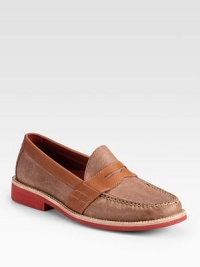 A traditional loafer style is redefined by its contrasts in finely textured leather.Leather upperLeather liningPadded insoleRubber soleImported A traditional loafer style is redefined by its contrasts in finely textured leather.Leather upperLeather liningPadded insoleRubber soleImported