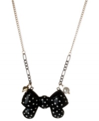 Tie this on for size. This polka dot bow pendant from Betsey Johnson makes a fun statement. Crafted from antique gold-tone mixed metal with added black tones, the necklace also features a glass pearl accent for a stylish touch. Item comes packaged in a signature Betsey Johnson Gift Box. Approximate length: 16 inches + 3-inch extender. Approximate drop: 1 inch. Tie this on for size. This polka dot bow pendant from Betsey Johnson makes a fun statement. Crafted from antique gold-tone mixed metal with added black tones, the necklace also features a glass pearl accent for a stylish touch. Item comes packaged in a signature Betsey Johnson Gift Box. Approximate length: 16 inches + 3-inch extender. Approximate drop: 1 inch.