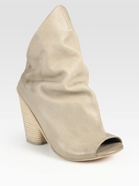 Extended asymmetrical vamp and a wide, stacked heel revive this ankle-grazing leather classic. Stacked heel, 4 (100mm)Leather upperLeather lining and solePadded insoleMade in Italy Extended asymmetrical vamp and a wide, stacked heel revive this ankle-grazing leather classic. Stacked heel, 4 (100mm)Leather upperLeather lining and solePadded insoleMade in Italy