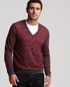 This BOSS Orange wool sweater boasts fine stripes in rich hues for season-perfect style.