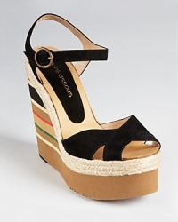 A colorful, striped wedge radiates summer style on Andre Assous' Pipoan wedges. These sky-high sandals bring the heat in soft black suede and braided jute trim. A colorful, striped wedge radiates summer style on Andre Assous' Pipoan wedges. These sky-high sandals bring the heat in soft black suede and braided jute trim.