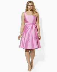 The perennially chic Kelwin dress exudes timeless femininity in lustrous silk dupioni with a chic scoop neckline and a graceful full skirt. The perennially chic Kelwin dress exudes timeless femininity in lustrous silk dupioni with a chic scoop neckline and a graceful full skirt.