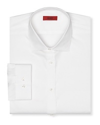 Contemporary fit shirt with spread collar. Square cuffs with two buttons to resize width. Clean front, no pocket. Back yoke with two darts. Contemporary fit shirt with spread collar. Square cuffs with two buttons to resize width. Clean front, no pocket. Back yoke with two darts.