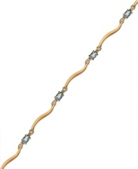 Cool blue. Victoria Townsend's stunning bracelet combines oval-cut blue topaz (1-5/8 ct. t.w.) and diamond accents in 18k gold over sterling silver. Approximate length: 7-1/4 inches. Cool blue. Victoria Townsend's stunning bracelet combines oval-cut blue topaz (1-5/8 ct. t.w.) and diamond accents in 18k gold over sterling silver. Approximate length: 7-1/4 inches.