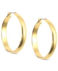 Go full circle with this set of hoop earrings from Anne Klein. Crafted from gold-tone mixed metal, the pair makes a subtle, yet bold statement. Approximate diameter: 1-1/4 inches. Go full circle with this set of hoop earrings from Anne Klein. Crafted from gold-tone mixed metal, the pair makes a subtle, yet bold statement. Approximate diameter: 1-1/4 inches.