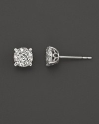 Classic faceted diamond studs set in 14K, white gold. Classic faceted diamond studs set in 14K, white gold.