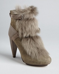 Runway ready, these Rebecca Taylor shearling boots are full-on stylish, set on lofty wedges for supermodel height. Runway ready, these Rebecca Taylor shearling boots are full-on stylish, set on lofty wedges for supermodel height.